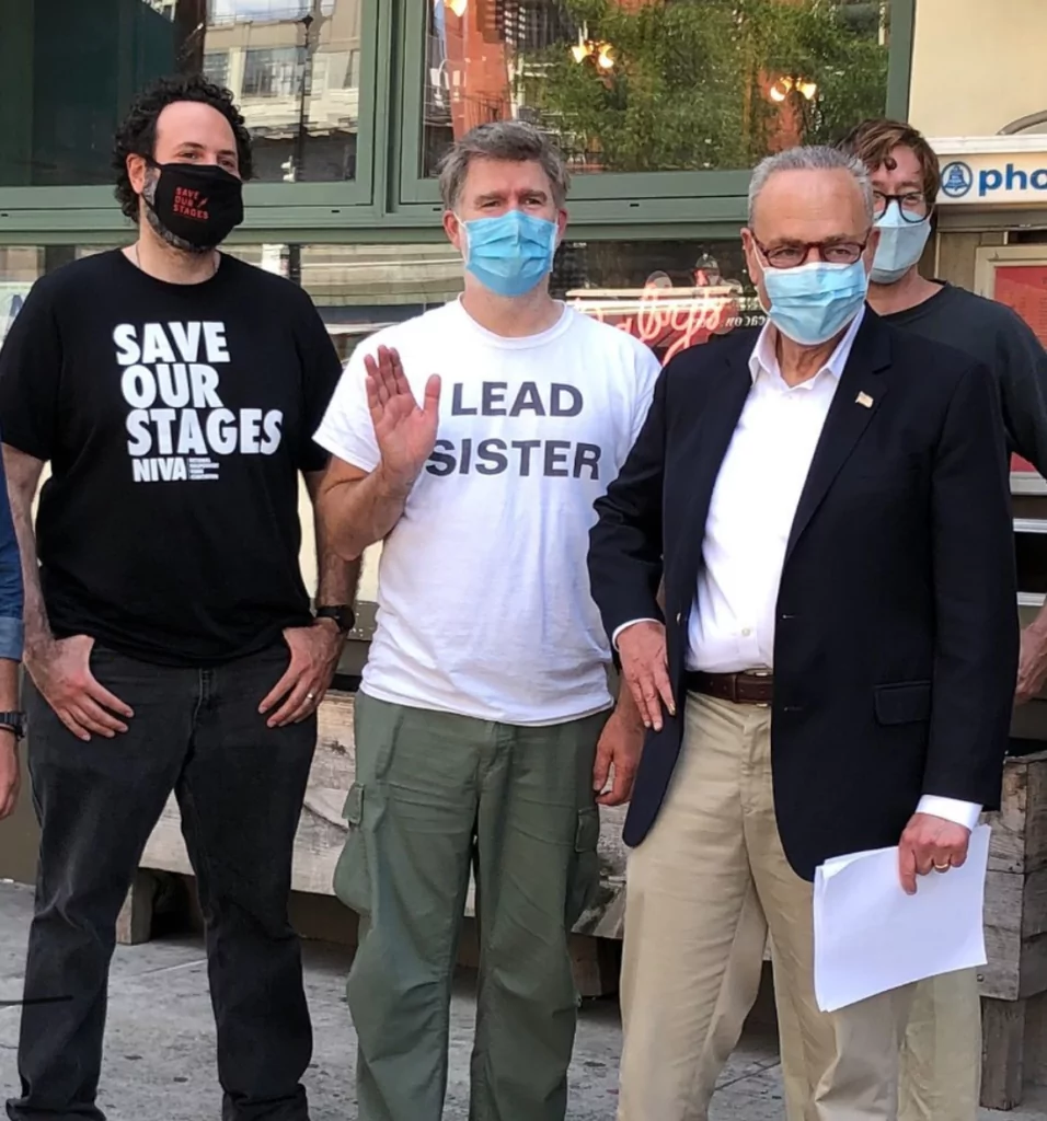 Senator Chuck Schumer, LCD Soundsystem frontman James Murphy, and NIVA Executive Director Rev. Moose