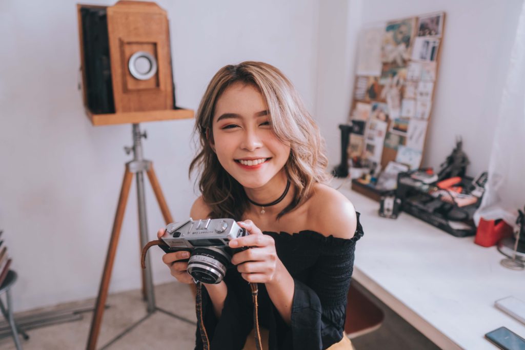 Brand ambassador with camera making content for social media