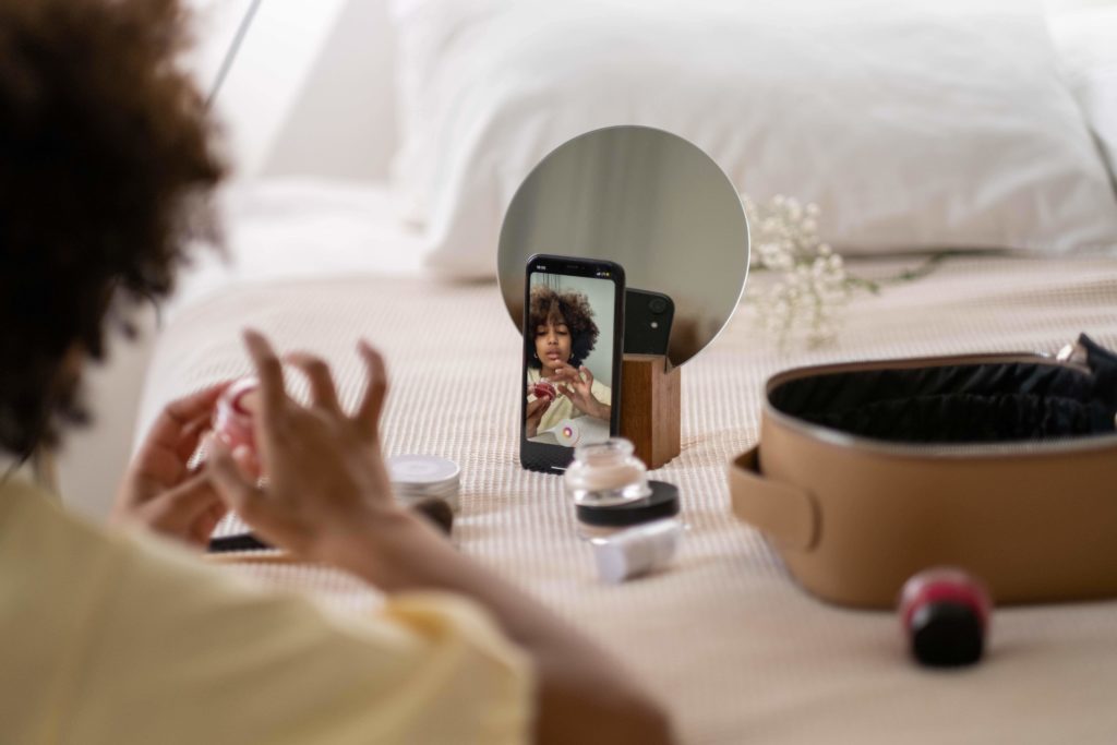 Brand ambassador filming herself using a product